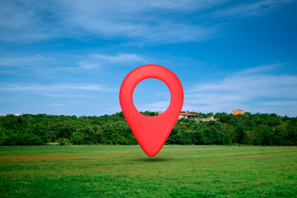 location-symbol-with-landscape-background